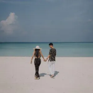 Wedding couple walking hand in hand - cinematic wedding in India